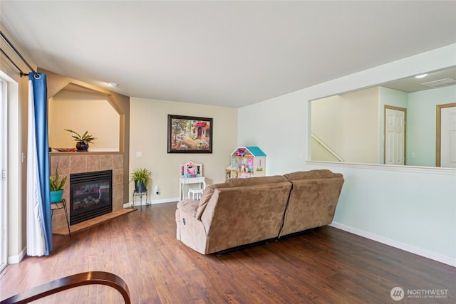 17707 1st Avenue Ct E, Spanaway, WA 98387 - living room featuring wood finished floors and a fireplace