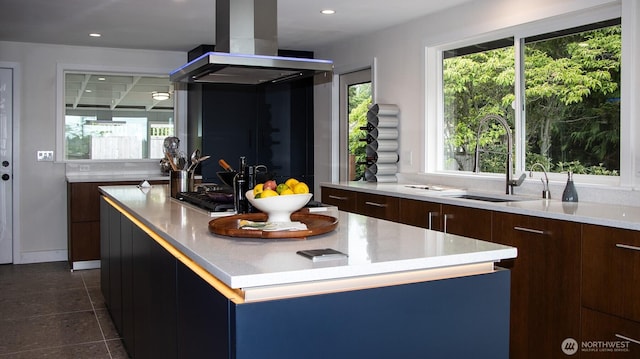220 Colman Dr, Port Townsend, WA 98368 - kitchen with island range hood, modern cabinets, a kitchen island, light countertops, and recessed lighting