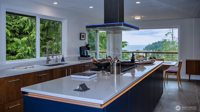 220 Colman Dr, Port Townsend, WA 98368 - kitchen with island exhaust hood, modern cabinets, plenty of natural light, and recessed lighting