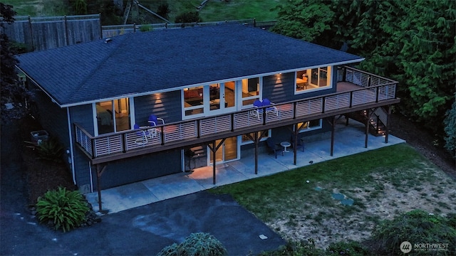 220 Colman Dr, Port Townsend, WA 98368 - rear view of house featuring a patio, a lawn, a deck, and a shingled roof