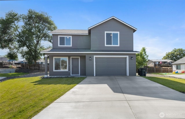 928 N Washington Ct, Moses Lake, WA 98837 - traditional-style home with an attached garage, driveway, and a shingled roof