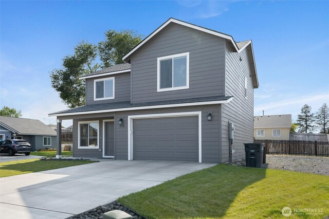 928 N Washington Ct, Moses Lake, WA 98837 - view of front of home with an attached garage, driveway, and roof with shingles