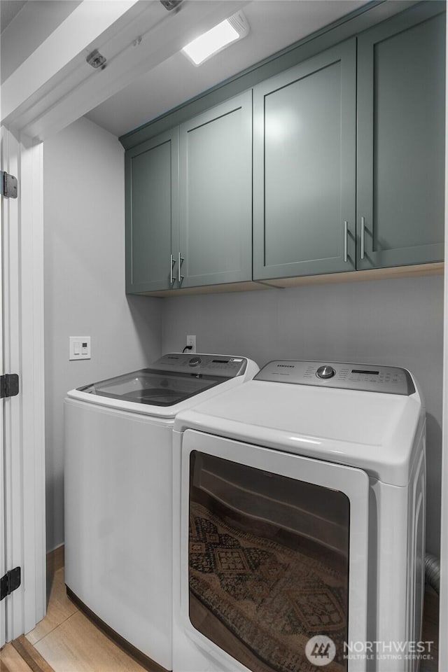 477 Ocean Shores Blvd SW, Ocean Shores, WA 98569 - laundry room with separate washer and dryer and cabinet space