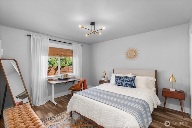 477 Ocean Shores Blvd SW, Ocean Shores, WA 98569 - bedroom featuring wood finished floors and a chandelier