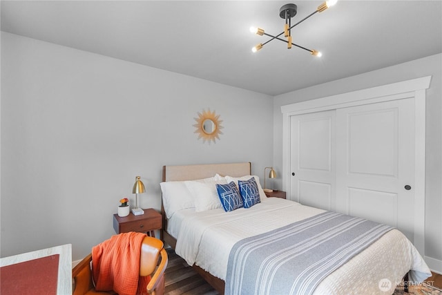 477 Ocean Shores Blvd SW, Ocean Shores, WA 98569 - bedroom with a chandelier, a closet, and wood finished floors