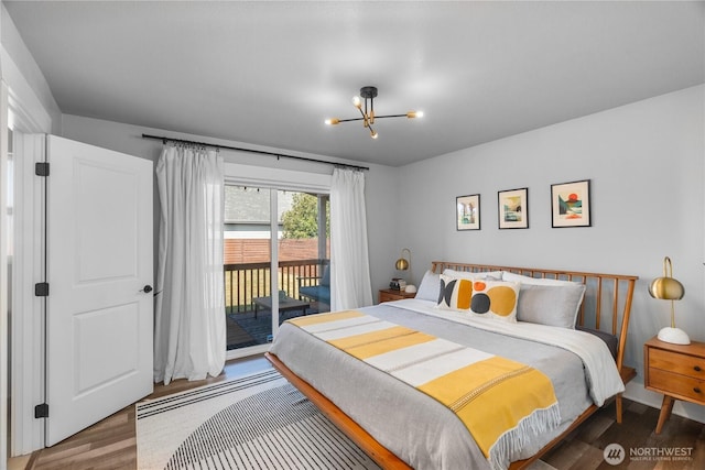 477 Ocean Shores Blvd SW, Ocean Shores, WA 98569 - bedroom with wood finished floors, access to outside, and a chandelier