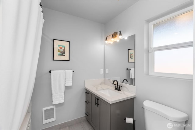 477 Ocean Shores Blvd SW, Ocean Shores, WA 98569 - full bath with vanity, heating unit, and tile patterned floors