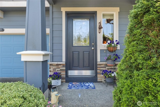 26707 NE 144th Ct, Duvall, WA 98019 - property entrance featuring a garage, a porch, and stone siding