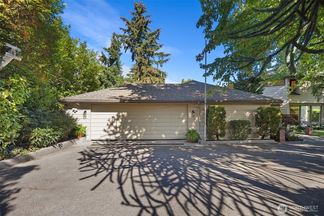 4662 95th Ave NE, Yarrow Point, WA 98004 - view of property exterior featuring an attached garage and driveway