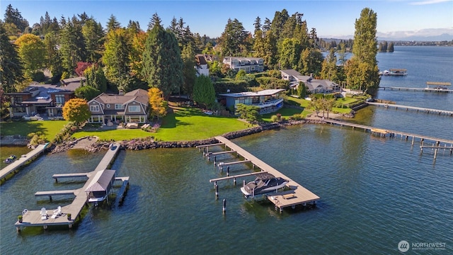 4662 95th Ave NE, Yarrow Point, WA 98004 - dock area with boat lift, a water view, and a lawn