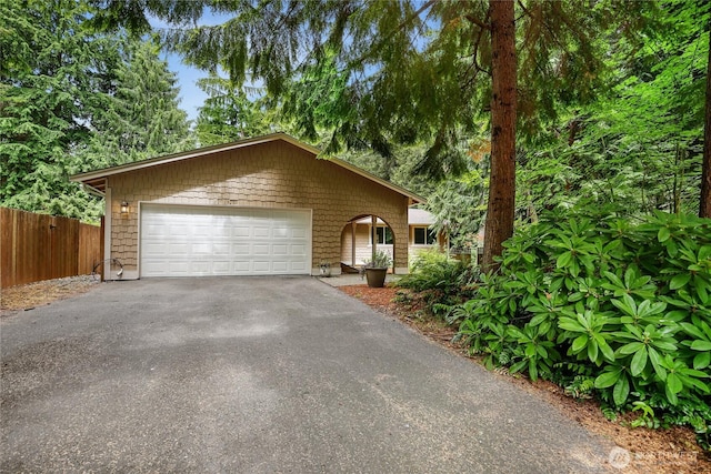 8200 NE View Ridge Ln, Poulsbo, WA 98370 - view of front of home with a garage and asphalt driveway