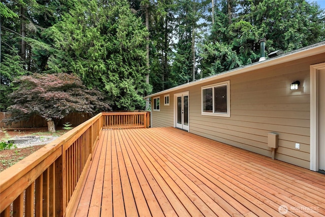 8200 NE View Ridge Ln, Poulsbo, WA 98370 - wooden terrace with french doors and view of wooded area