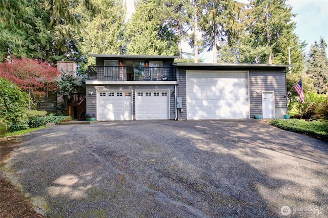 908 185th St SW, Lynnwood, WA 98037 - view of front of property with a garage and a balcony