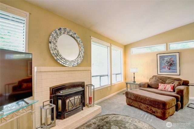 908 185th St SW, Lynnwood, WA 98037 - living area featuring carpet flooring, lofted ceiling, and a wood stove