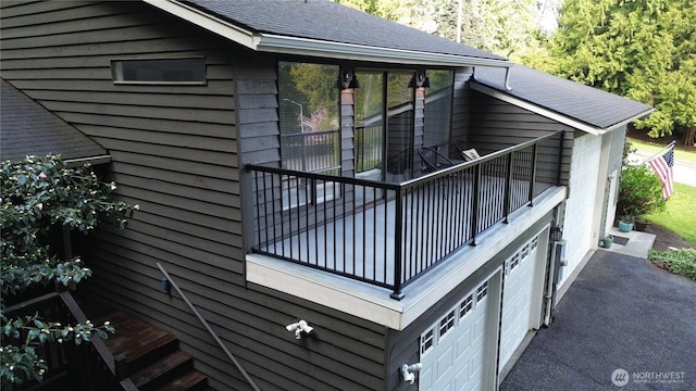 908 185th St SW, Lynnwood, WA 98037 - view of property exterior featuring a balcony and roof with shingles