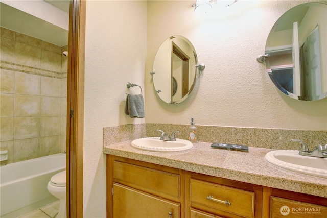 908 185th St SW, Lynnwood, WA 98037 - bathroom with double vanity, tile patterned floors, and shower / tub combination
