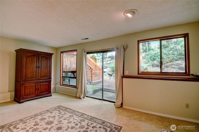 908 185th St SW, Lynnwood, WA 98037 - unfurnished room with light colored carpet and a textured ceiling
