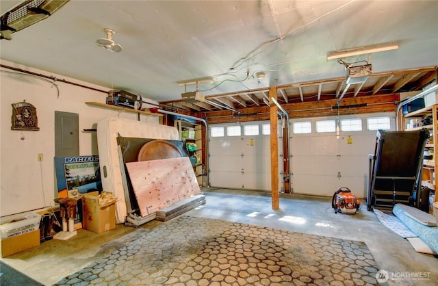 908 185th St SW, Lynnwood, WA 98037 - garage with electric panel and a garage door opener