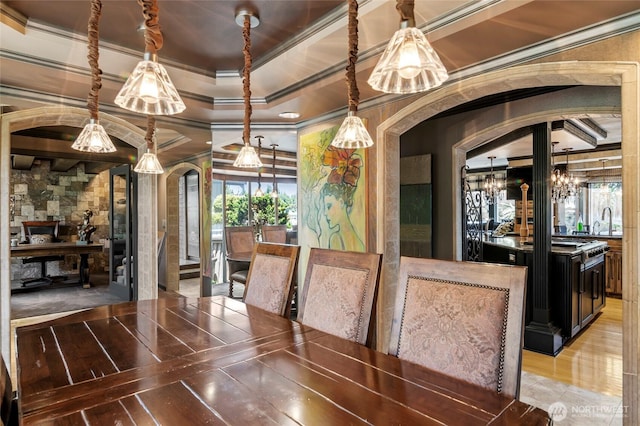 1504 E Lakeshore Dr, Lake Stevens, WA 98258 - unfurnished dining area featuring ornamental molding, arched walkways, and a chandelier