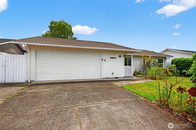 1538 Orchid Ct, Longview, WA 98632 - ranch-style house featuring roof with shingles, concrete driveway, and an attached garage