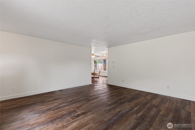 1538 Orchid Ct, Longview, WA 98632 - empty room with dark wood-style floors and a textured ceiling