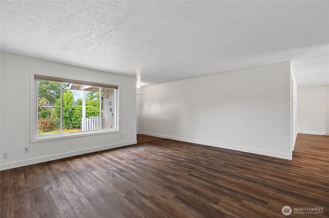 1538 Orchid Ct, Longview, WA 98632 - empty room with dark wood-style floors and a textured ceiling