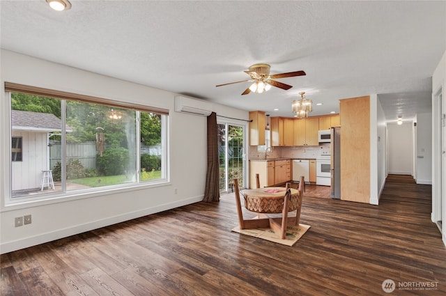 1538 Orchid Ct, Longview, WA 98632 - kitchen featuring a wall mounted air conditioner, white appliances, a ceiling fan, dark wood-style flooring, and light brown cabinets