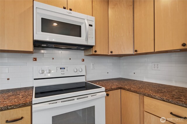 1538 Orchid Ct, Longview, WA 98632 - kitchen featuring white appliances, backsplash, and dark stone countertops