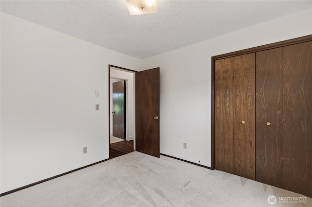 1538 Orchid Ct, Longview, WA 98632 - unfurnished bedroom featuring carpet flooring, a closet, and a textured ceiling