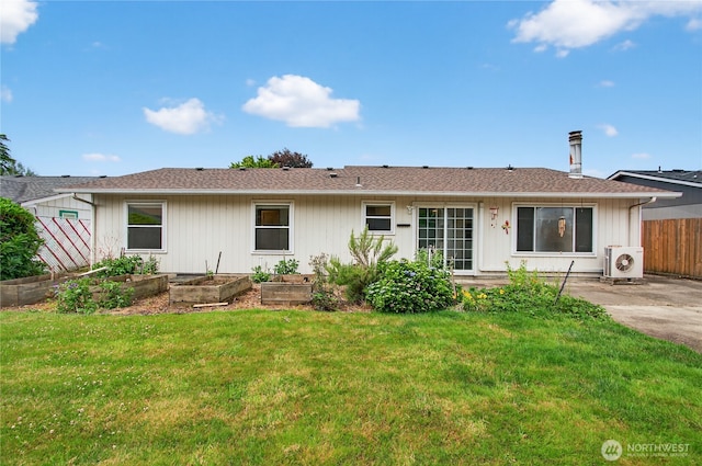 1538 Orchid Ct, Longview, WA 98632 - rear view of house with a vegetable garden