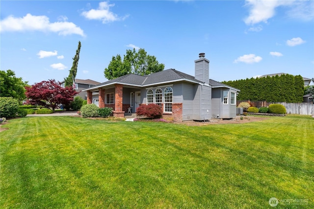 840 Amy Ct, East Wenatchee, WA 98802 - back of house with a chimney, brick siding, and a porch