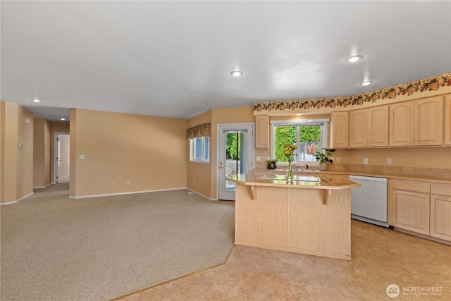 840 Amy Ct, East Wenatchee, WA 98802 - kitchen with dishwasher, light brown cabinetry, light countertops, a breakfast bar, and recessed lighting