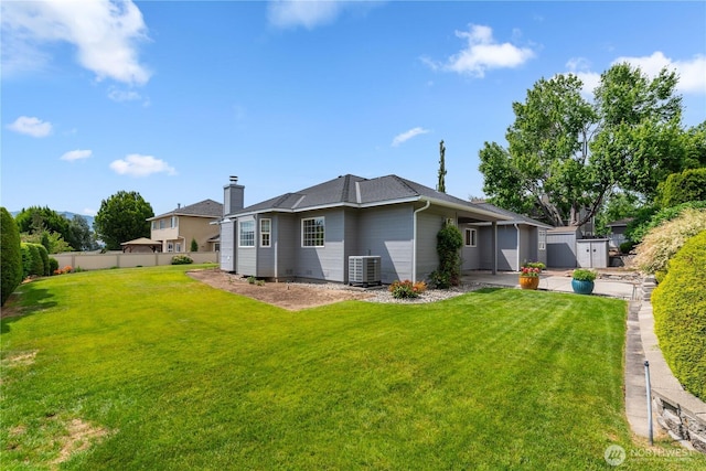 840 Amy Ct, East Wenatchee, WA 98802 - rear view of house featuring a chimney and an attached garage