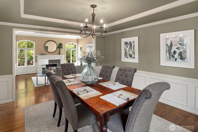 2778 142nd Pl NE, Bellevue, WA 98007 - dining room featuring healthy amount of natural light, a chandelier, dark wood finished floors, a wainscoted wall, and a tray ceiling