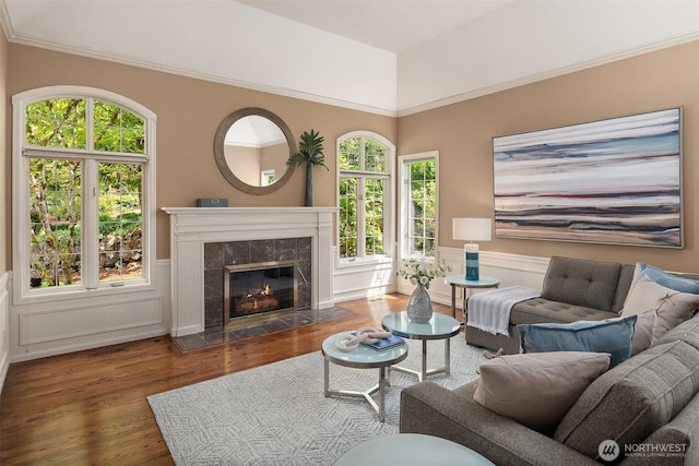 2778 142nd Pl NE, Bellevue, WA 98007 - living room featuring wood finished floors, a fireplace, vaulted ceiling, and wainscoting