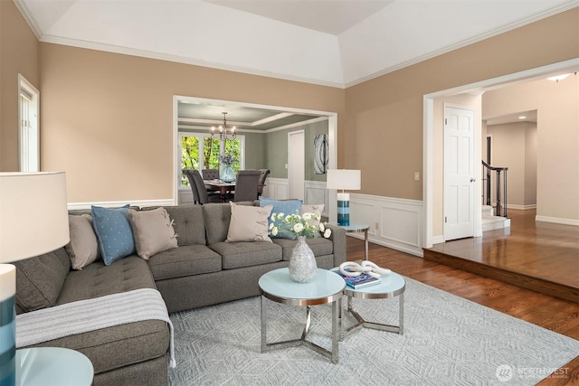 2778 142nd Pl NE, Bellevue, WA 98007 - living area featuring wood finished floors, a chandelier, a wainscoted wall, ornamental molding, and stairs