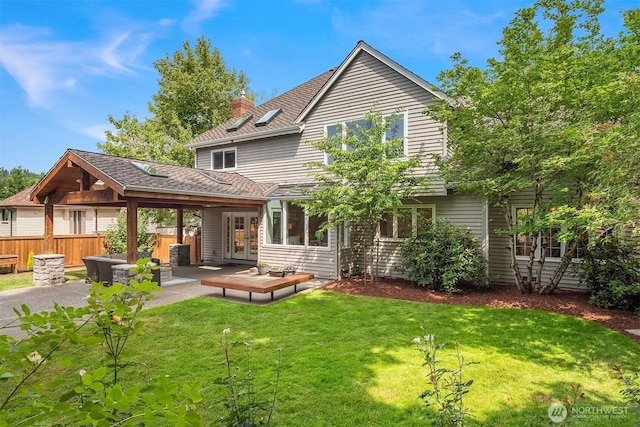 2778 142nd Pl NE, Bellevue, WA 98007 - back of property with french doors, a patio, a chimney, and roof with shingles