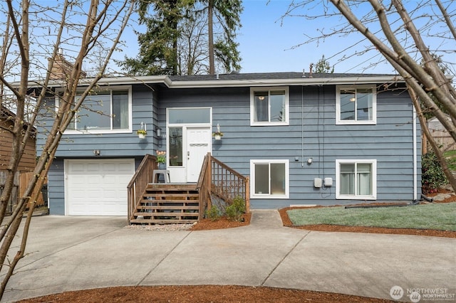 5113 212th St SW, Lynnwood, WA 98036 - view of front of home featuring concrete driveway and a garage