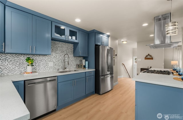5113 212th St SW, Lynnwood, WA 98036 - kitchen with stainless steel appliances, blue cabinets, island exhaust hood, light wood-style floors, and recessed lighting