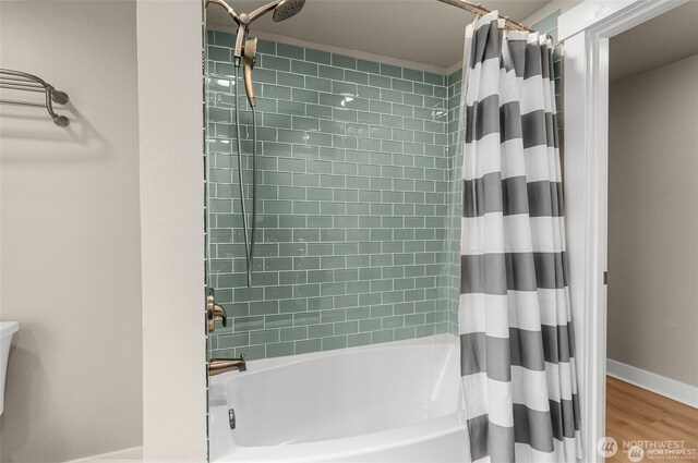 5113 212th St SW, Lynnwood, WA 98036 - bathroom featuring shower / bathtub combination with curtain and wood finished floors