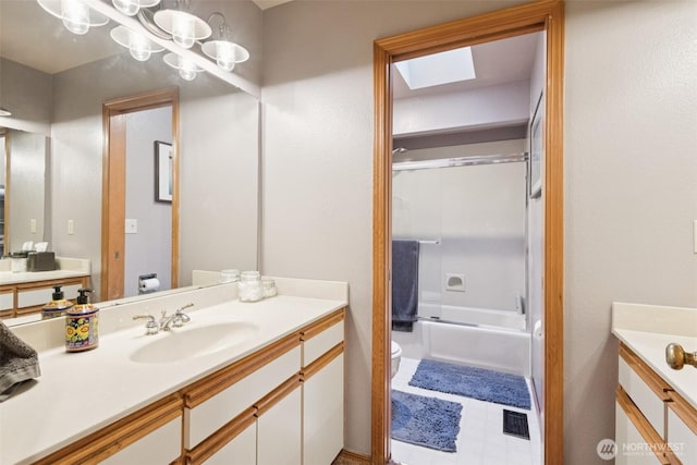 24230 218th Ave SE, Maple Valley, WA 98038 - full bathroom featuring vanity, bath / shower combo with glass door, and a skylight