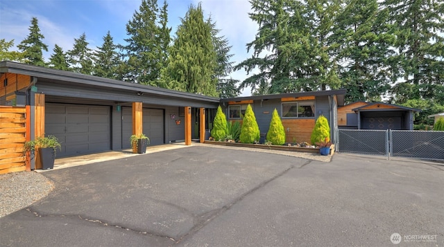 501 143rd St S, Tacoma, WA 98444 - view of front facade featuring a garage, driveway, and a gate