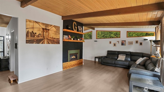 501 143rd St S, Tacoma, WA 98444 - living room featuring wood finished floors, a wood ceiling with exposed beams, and a brick fireplace