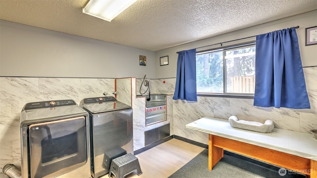 501 143rd St S, Tacoma, WA 98444 - laundry room with separate washer and dryer and a textured ceiling
