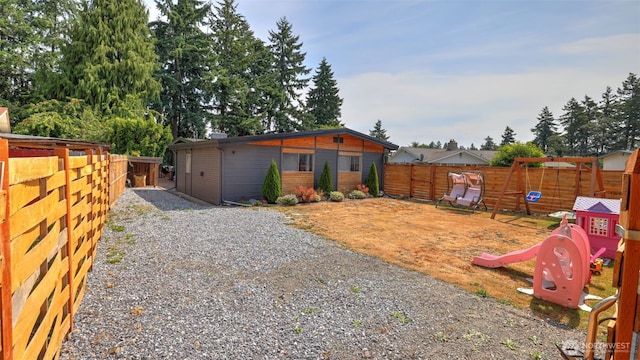 501 143rd St S, Tacoma, WA 98444 - back of house featuring a playground and a fenced backyard