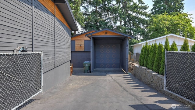 501 143rd St S, Tacoma, WA 98444 - garage featuring asphalt driveway