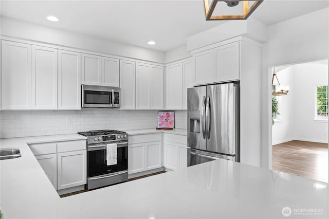 1611 Austin Ave, Snohomish, WA 98290 - kitchen featuring appliances with stainless steel finishes, decorative backsplash, white cabinetry, light countertops, and recessed lighting
