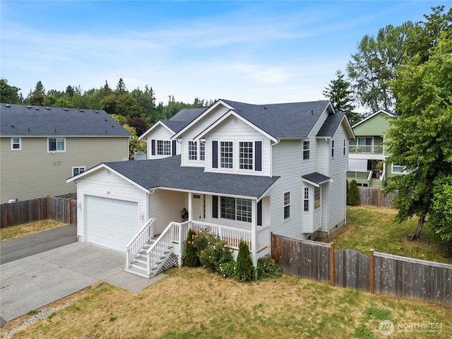1611 Austin Ave, Snohomish, WA 98290 - traditional-style home featuring a porch, driveway, an attached garage, and a shingled roof