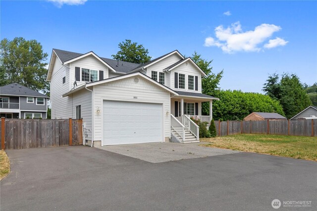 1611 Austin Ave, Snohomish, WA 98290 - traditional home with driveway, a garage, and covered porch