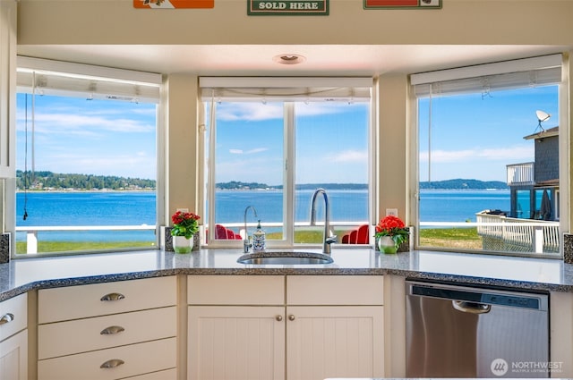 9340 SE Cornell Rd, Port Orchard, WA 98366 - kitchen with stainless steel dishwasher, white cabinetry, and plenty of natural light